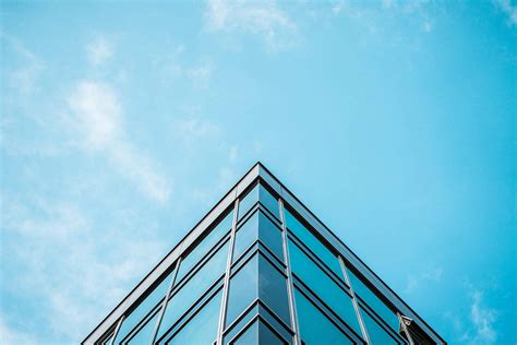 Business Skyscraper Office Building And Blue Sky Free Stock Photo