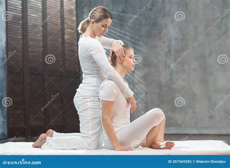 Young Woman Is Getting Thai Massage Treatment By Therapist Traditional Asian Stretching Therapy