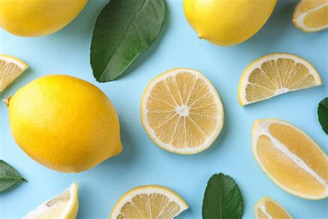 Flat Lay Composition With Fresh Lemons On Blue Background Stock Image