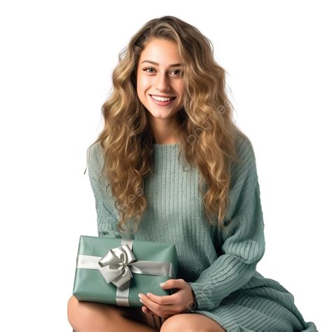 A Beautiful Girl In A Knitted Sweater Is Sitting On A Rug Holding A T Box At The Christmas