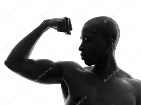 African Black Man Flexing Muscle Silhouette — Stock Photo © Stylepics