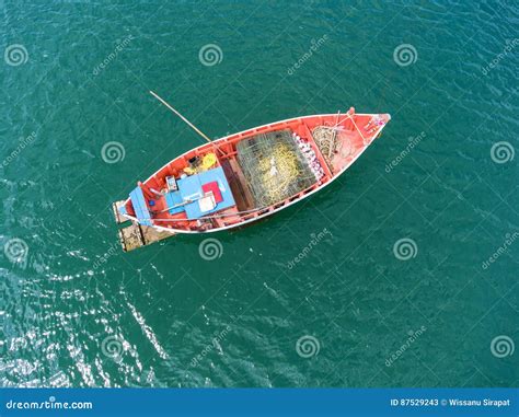 Fishing Boat Floating In The Sea The Beautiful Bright Blue Water In A