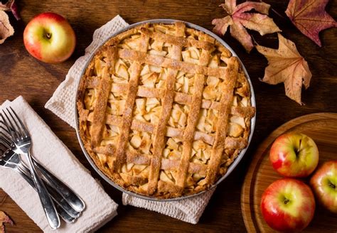 Top View Of Apple Pie For Thanksgiving With Cutlery And Leaves Free Photo
