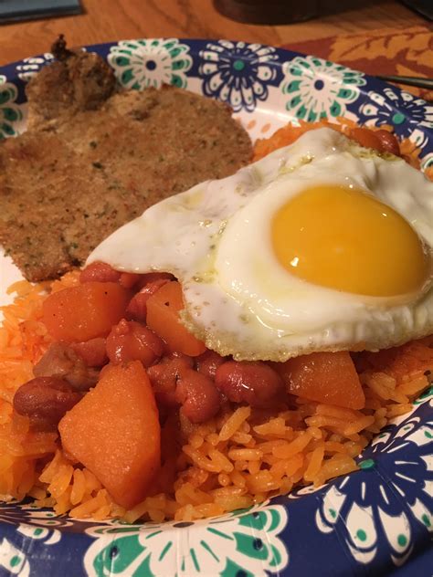 Puerto Rican Pork Chop Rice And Beans With A Sunny Side Egg Putaneggonit