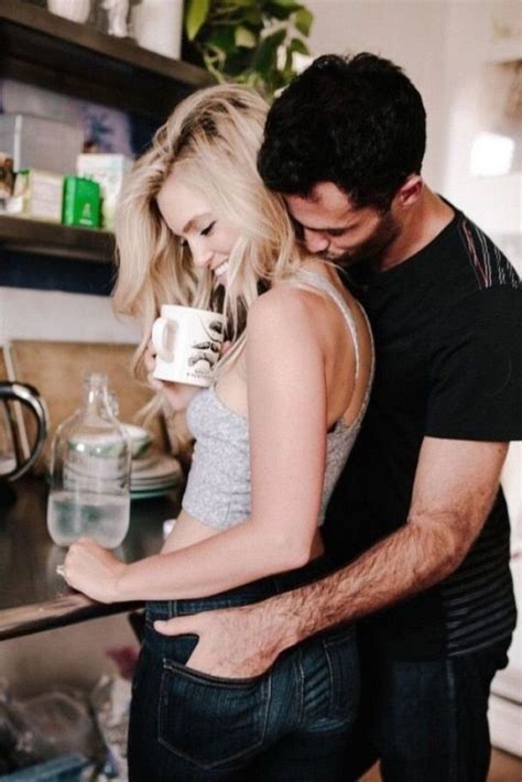 couple cuddling in kitchen relationship couples couple photography romantic couples