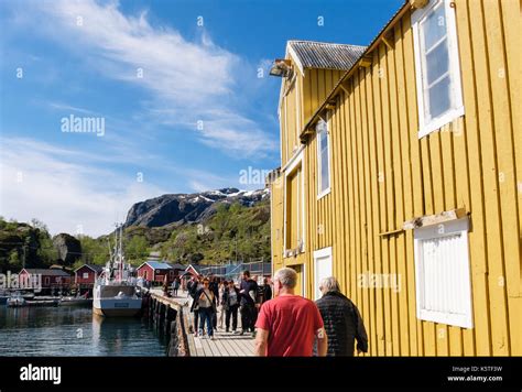 Tourists Visiting Historic Fishing Village Harbour In Nusfjord