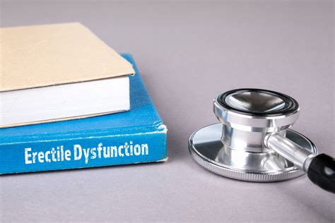 erectile dysfunction blue book on a gray office table trtmd men s health clinic