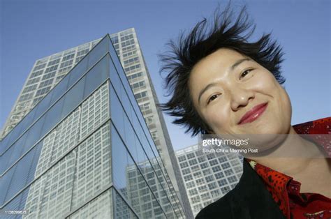 The Co Ceo Of Soho China Ltd Zhang Xin Stands In Front Of Their