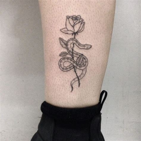 Tattoo Of A Snake Wrapped Around A Rose Trendy Tattoos Body Art