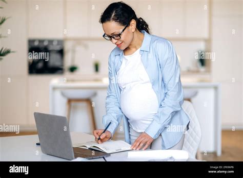 pregnant female office employer beautiful successful pregnant woman wearing glasses top