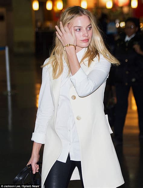 Margot Robbie Lands In New York After Turning Heads At The Oscars
