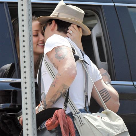 Amber Heard Steals A Kiss From Johnny Depp E Online Uk