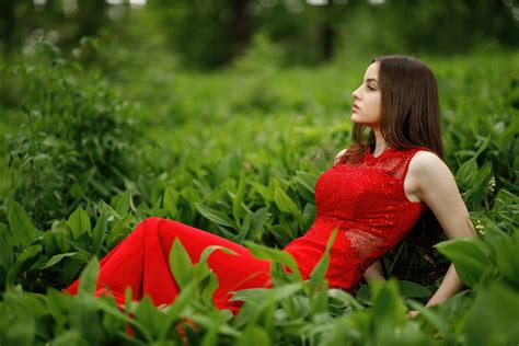 Red Dressed Beauty Reclining On Green Grass Wallpaperhd Girls Wallpapers4k Wallpapersimages