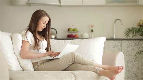 Young Woman Relaxing On Sofa With Laptop Stock Footage Sbv 303981602 Storyblocks