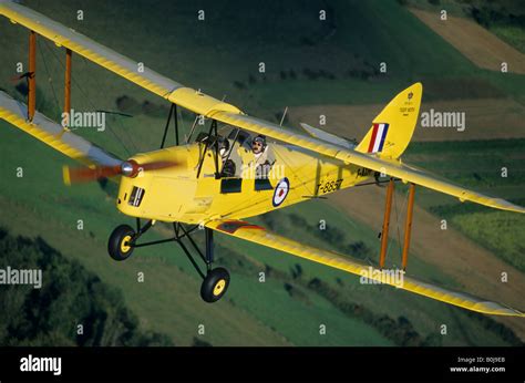 Old British Trainer Biplane De Havilland Dh C Tiger Moth In Flight