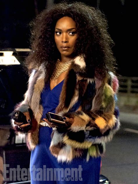 A Woman In Blue Jumpsuit And Fur Coat