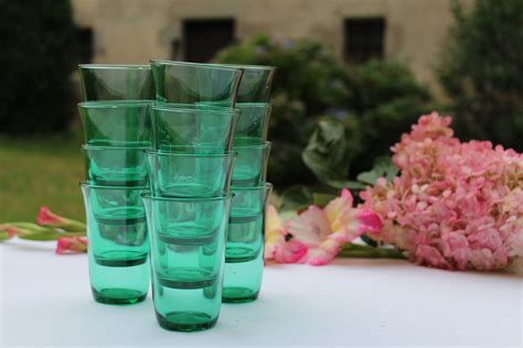 If you're using old candles that are already scented, adding extra scent isn't always the best idea although an extra. French Vintage Green Glass Votive Holders, Green Shot Glasses, Tea Light Holders, Hors D'oeuvres ...