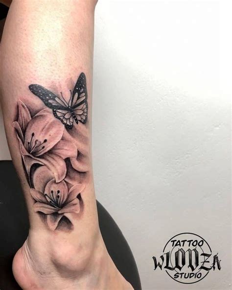 Lily Tattoo With A Butterfly Over Leg Lily Tattoo Flower Leg Tattoos