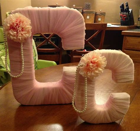 All you need to make these cupcake toppers is pink streamers, ribbon, white cardstock paper, and sticks. Pin on Baby Shower Games