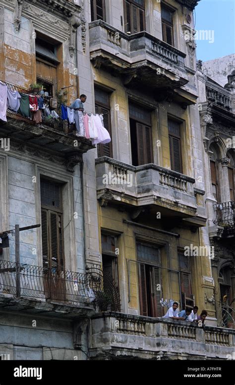 Cuba Havanapeople On Balconies Of Dilapidated Building Overlooking