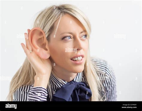 Woman Listening With Ridiculously Big Ear Stock Photo Alamy