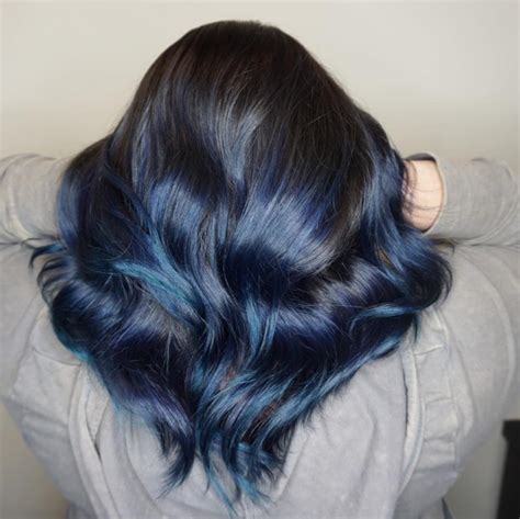 This black hair goes from black to different shades of blue. 19 Most Amazing Blue Black Hair Color Looks of 2019