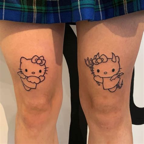 Two Hello Kitty Tattoos On Both Legs One With An Antelope And The