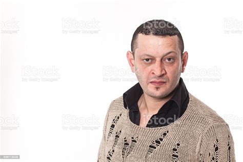 Frowning Man Portrait Looking At Camera Stock Photo Download Image