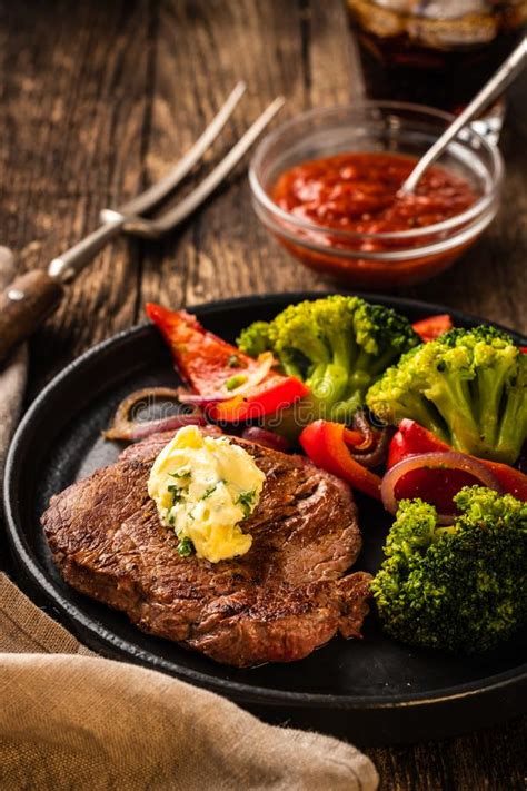 Grilled Beef Steak With Garlic Butter And Vegetables Meat With Stock