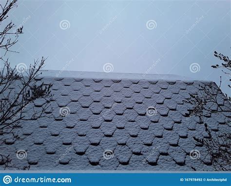 Snow Covered Roof Of The House Soft Roof Tiles In Winter Stock Photo