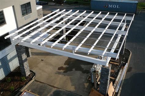 Here are some framing details from the mossie fbvi parts manual. Flat roof Porte Cochere installed on existing steel subframe