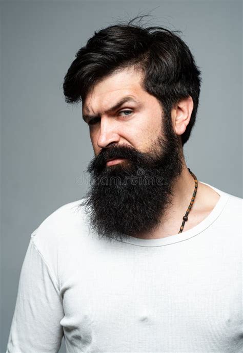 Portrait Of Confident Serious Man Hipster Guy Models In Studio