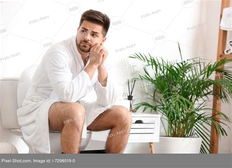 Babe Man Sitting On Toilet Bowl In Restroom Stock Photography Agency Pixel Shot Studio
