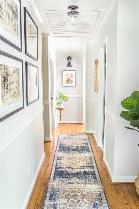 6 Tips To Decorate A Boring Hallway Narrow Hallway Decorating Hallway Decorating Upstairs