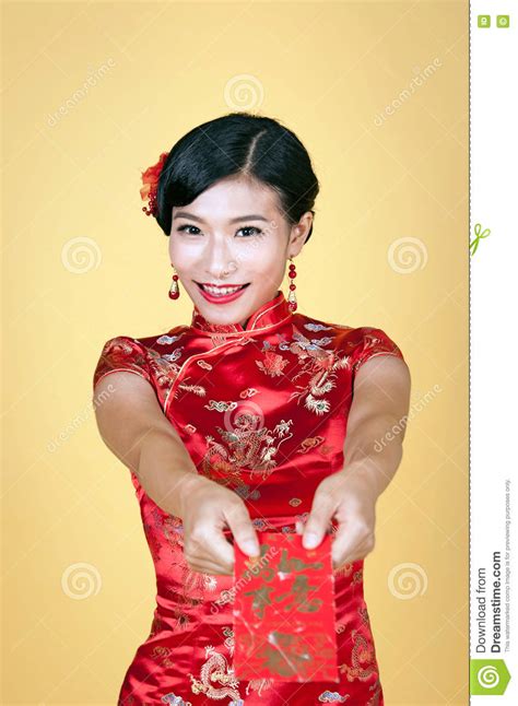 Pretty Chinese Young Woman Holding Red Pocket For Happy Chinese New