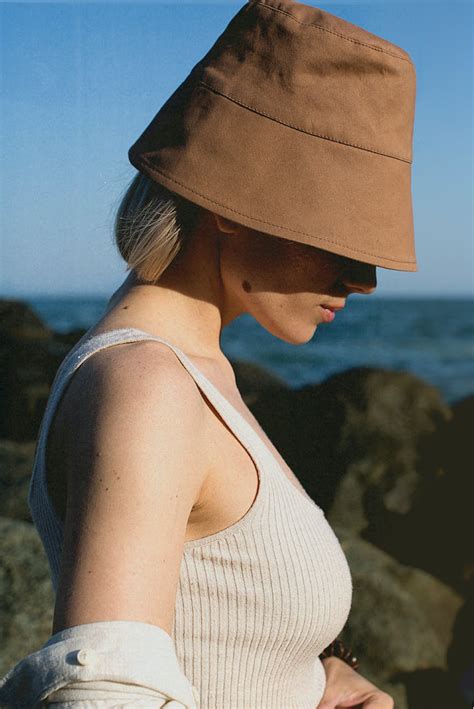 Woman In White Tank Top Wearing Brown Fedora Hat · Free Stock Photo