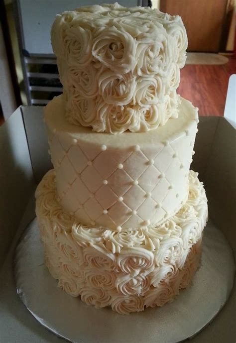 Three Tier Shabby Chic Textured Butter Cream Wedding Cake With Rosettes