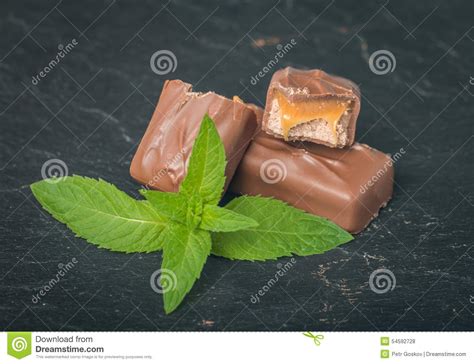 Chocolate Bar With Caramel And Mint Leaves Stock Photo Image Of