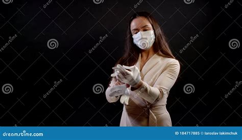 Adult Woman With Surgical Mask On Face Is Wearing Rubber Gloves And Showing Thumbs Up Stock
