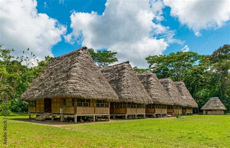 Traditional Housing In Large Wooden Huts With Palm Leaf Roof In The