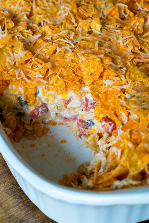 In a large bowl, combine the diced cooked chicken, sour cream, condensed soup, onion, chili powder, garlic powder, salt, and pepper. Doritos Chicken Casserole - 12 Tomatoes