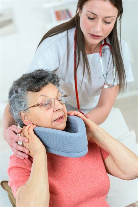 Doctor Putting Neck Brace On Woman Stock Photo Image Of Diseased