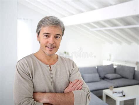 Handsome Man Standing In Living Room Stock Photo Image Of House
