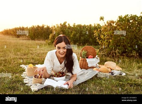 Beautiful Girl Enjoys Outdoor Picnic Stock Photo Alamy