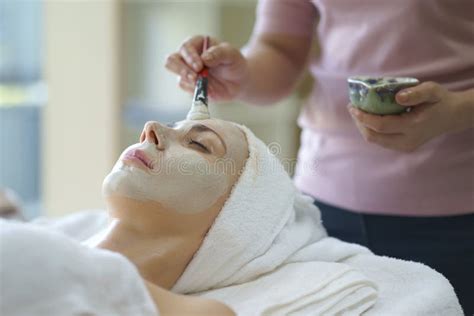 Beautiful Caucasian Woman Having Mask Lying On Spa Facial Treatment In Spa Salon Stock Image