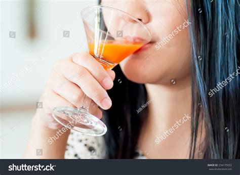 Womans Drinking Orange Juice Stock Photo Shutterstock