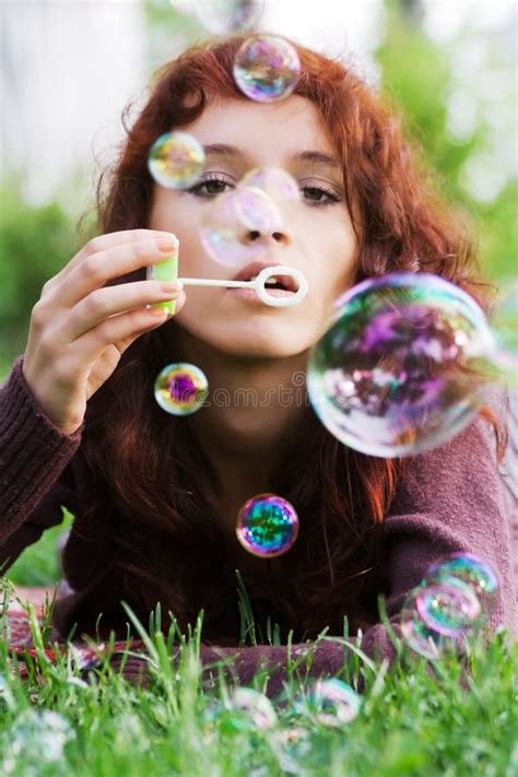 Young Woman Blowing Bubbles Stock Image Image Of Grass Beautiful
