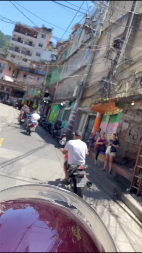 can you spot the captain in blue shorts back in rio s biggest favela rocinha best and