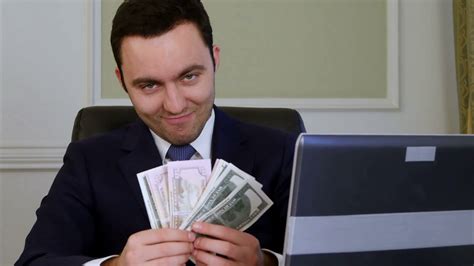 Successful businessman counts looking satisfied Stock Video Footage - Storyblocks
