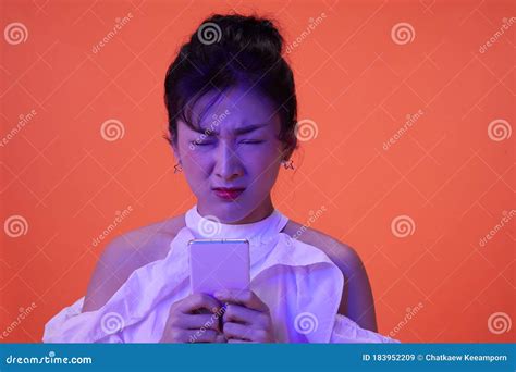 Asian Woman Is Rubbing Her Eyes Feeling Pain After Playing A Mobile